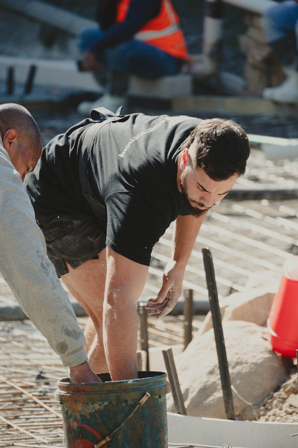 Two tradesmen on a concrete pour, TT Constructions